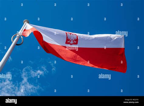 Flag Of Poland Waving In Wind Stock Photo Alamy