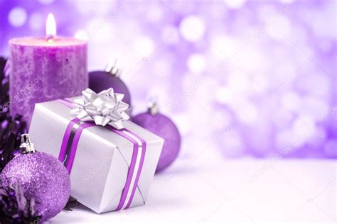 Purple Christmas Scene With Baubles T And Candles Stock Photo By
