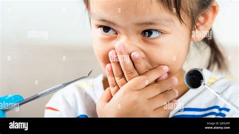 Dental Kid Examination Doctor Examines Oral Cavity Of Child Uses Mouth