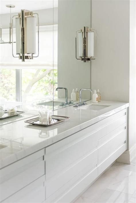Frameless bathroom mirrors are more than just practical objects in which to check your face. Keeley Tall Pivoting Sconces are mounted on frameless ...