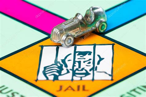 Car Token Next To The Jail In A Monopoly Game Stock Editorial Photo © Kmiragaya 65379679