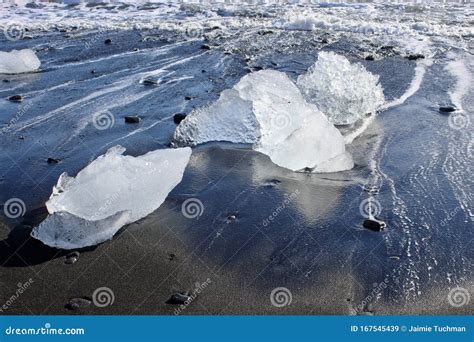 Large Pieces Of Iceberg On Black Sand Beach In Iceland Stock Image