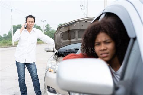 Asian Women Drivers Sit In Car For Waiting Insurance After Check For