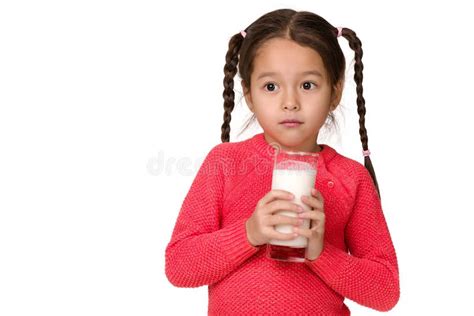 Little Child Girl Holding Glass Of Milk On White Background Stock Photo
