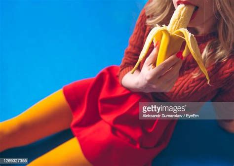 women eating bananas photos and premium high res pictures getty images
