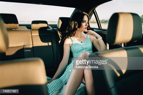 Caucasian Woman Sitting In Back Seat Of Car Photo Getty Images