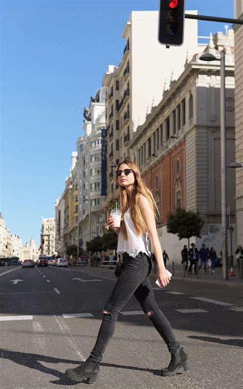 Stylish Girl Walking On Street Del Colaborador De Stocksy Milles Studio Stocksy