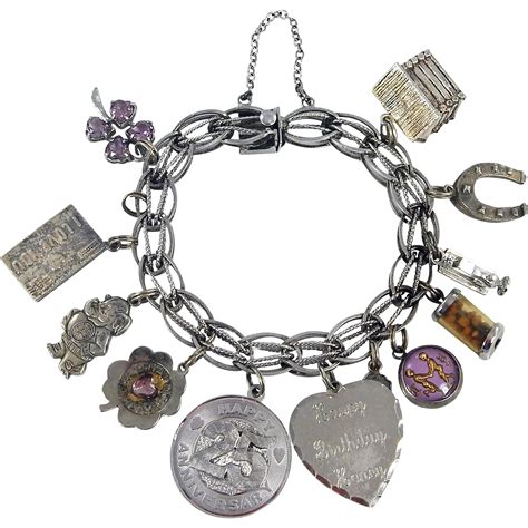 Vintage Sterling Silver Charm Bracelet With 12 Charms C 1970s From