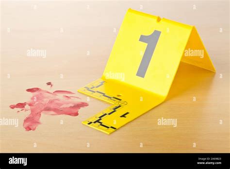 Crime Scene Investigation Csi Evidence Marker With Blood Spot On Wooden