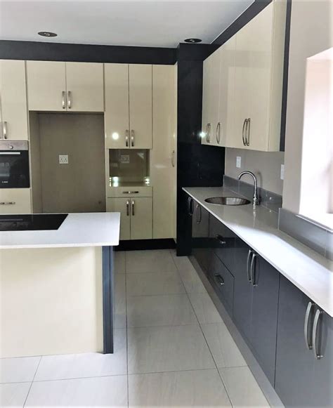 The cabinet finish you choose can create a vividly different look, regardless of the cabinet material you pick. High gloss modern two tone kitchen by zingana kitchens and ...