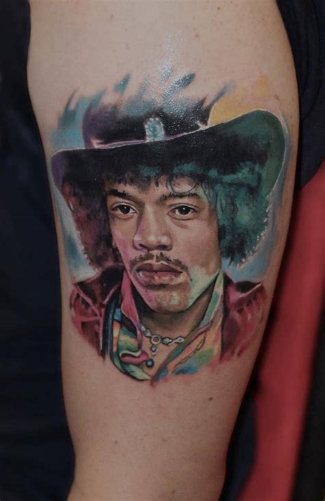 Realistic Jimi Hendrix Portrait Tattoo On The Left