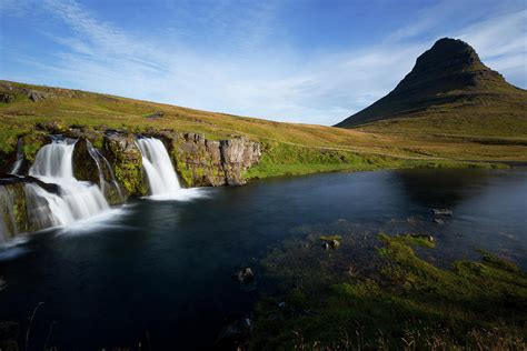 Kirkjufellsfoss Waterfall Cascading And Mount Kirkjufell In Back