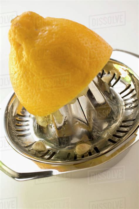 Lemon On Lemon Squeezer Stock Photo Dissolve