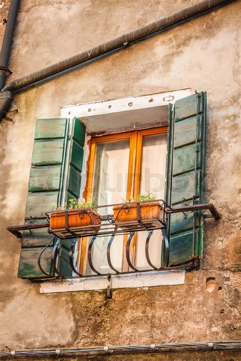 Buildings With Traditional Venetian Windows In Venice Italy Stock