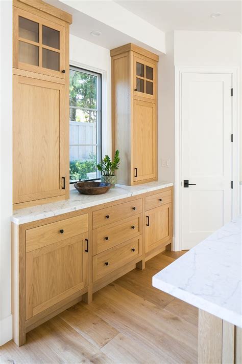 White Oak Kitchen Buffet Cabinet With White Marble Countertop And Black Hardware More Pictures