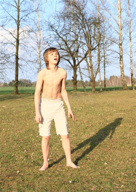 Barefoot Boy Standing On Grass Stock Image Image Of Grass Teen 52621723