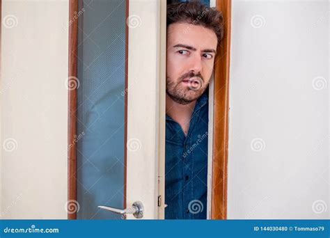 One Man Entering The Door And Spying Stock Photo Image Of Entry