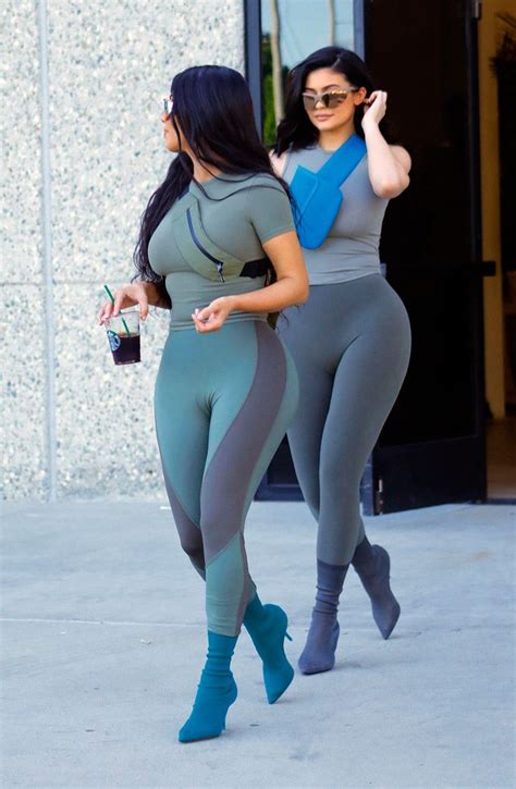 kim kardashian and kylie jenner twin in skintight leggings and yeezy heels kim kardashian