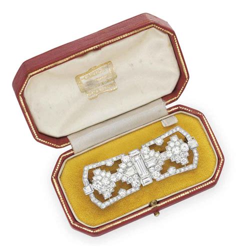 An Art Deco Diamond Brooch By Cartier Christies