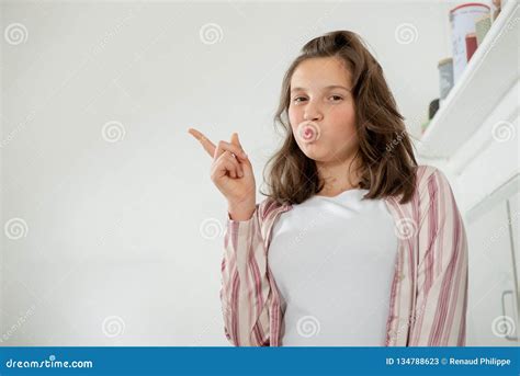 Pretty Teenage Girl Showing With A Finger Stock Image Image Of Finger Show 134788623
