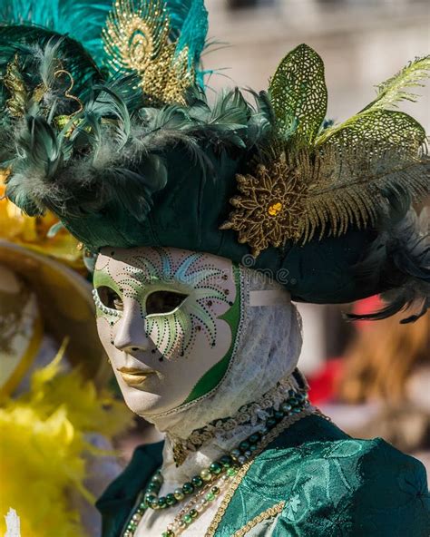 People Wearing Elaborate And Colorful Costumes And Masks During The