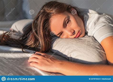 Funny Tired Lazy Asian Young Woman Waking Up In Bed Sleepy Morning Fatigue With Half Open Eyes