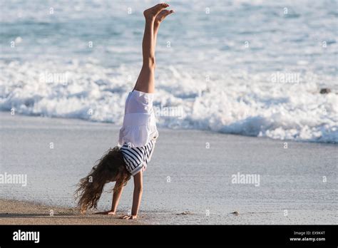 Young Girl Doing Handstand On The Beach Hi Res Stock Photography And