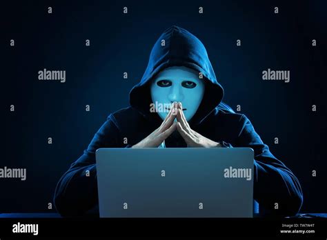 Hacker Anonymous Mask Using Laptop Hi Res Stock Photography And Images