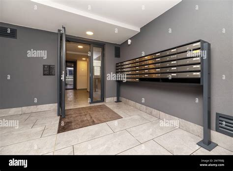 Lobby Of A Residential Building With Gray Marble Floors 18 Percent