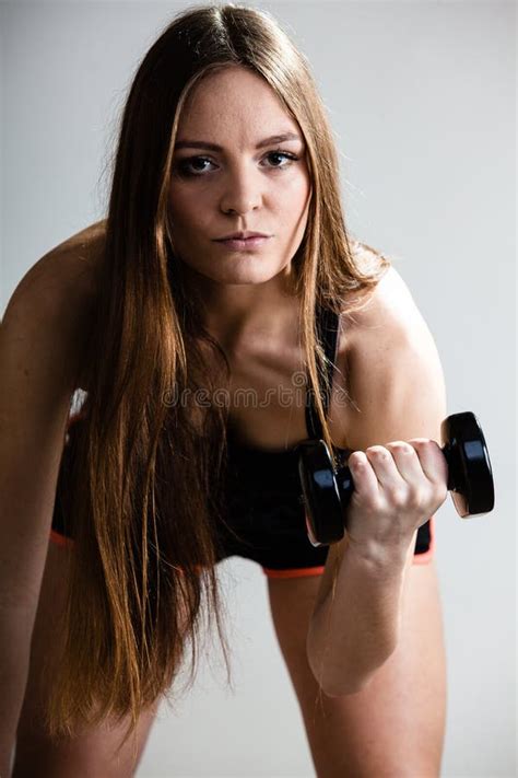 Fitness Girl Training Shoulder Muscles Lifting Dumbbells Stock Photo
