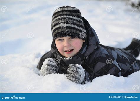 Teen Boy Lies On Snow In The Winter Forest Stock Image Image Of