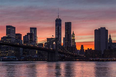 New York City Lower Manhattan Skyline And Brooklyn Bridge At Sunset