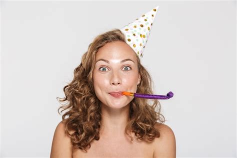 Premium Photo Surprised Half Naked Woman Wearing Party Cone Blowing In Whistle Isolated Over