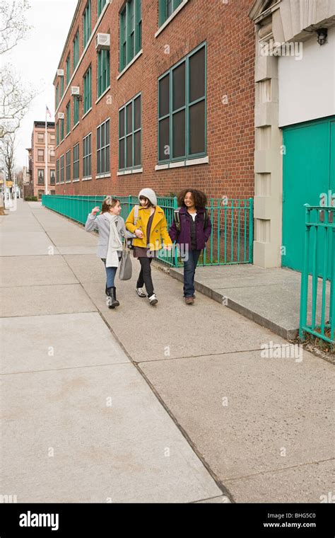 Girls Walking To School Stock Photo Alamy