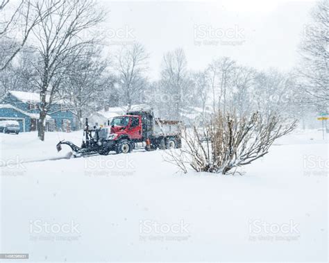 Blizzard Snow Snowplow Truck Plowing Residential Street Stock Photo
