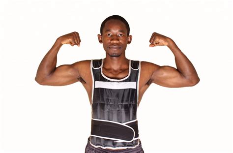 Muscular Man Wearing Weighted Vest Flexing Biceps