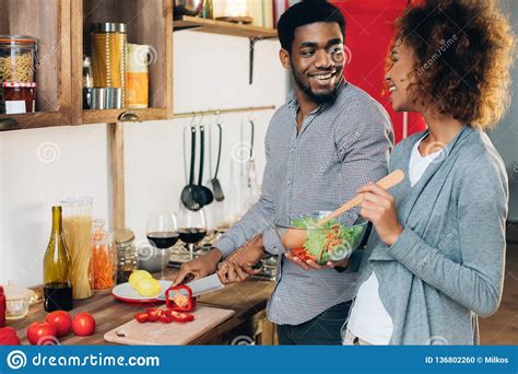 Check spelling or type a new query. Vegetarian African-american Couple Cooking Salad In Kitchen Stock Photo - Image of love, making ...