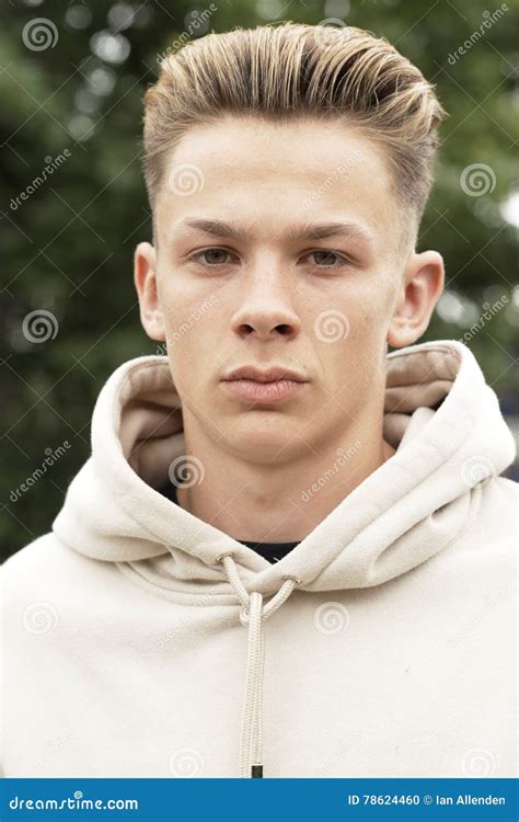 Head And Shoulders Portrait Of Serious Teenage Boy Stock Photo Image
