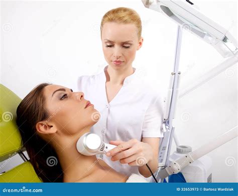 Woman Having A Stimulating Facial Treatment From A Therapist Stock Image Image Of Lies