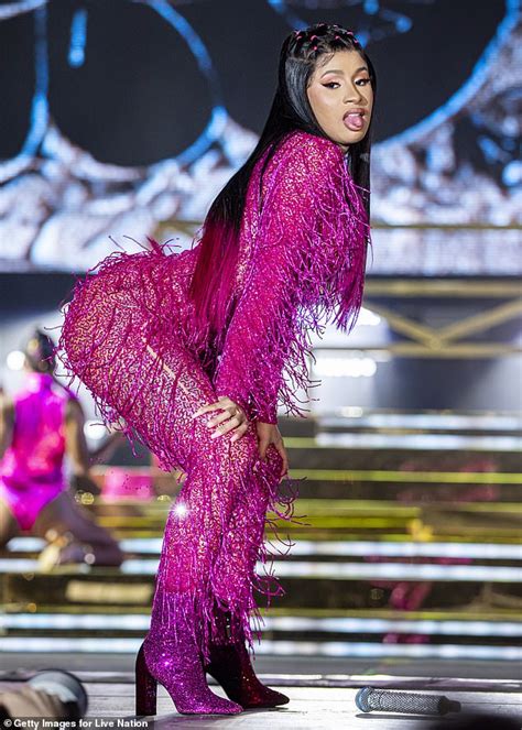 Cardi B Flaunts Her Curves And Saucy Charisma In A Purple Tasseled