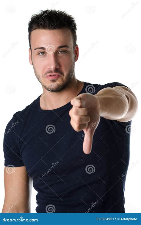 Disappointed Or Displeased Young Man Doing Thumb Down Sign Stock Image