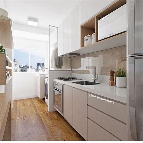 Cozinha e área de serviço integradas com máximo aproveitamento de espaço Ar em Cozinha