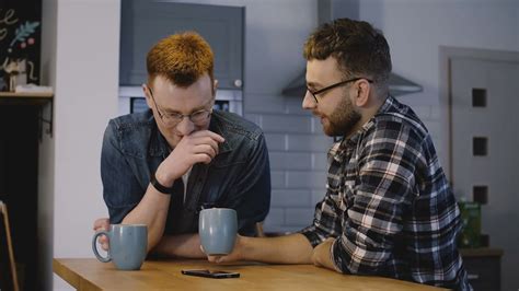 Two Male Friends Sit Kitchen Table Chat Stock Footage Sbv 322092088