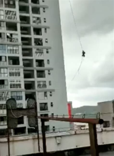 Watch The Moment Construction Workers Dangle From Cable In High Winds