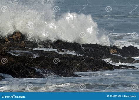 Giant Waves Crashing On Rocks Stock Photo Image Of Rock Pile 134539506