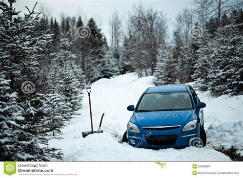 Car Stuck In The Snow On A Forest Road Stock Photo