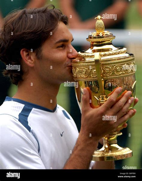 Switzerlands Roger Federer Kisses The Trophy After His Win Hi Res Stock
