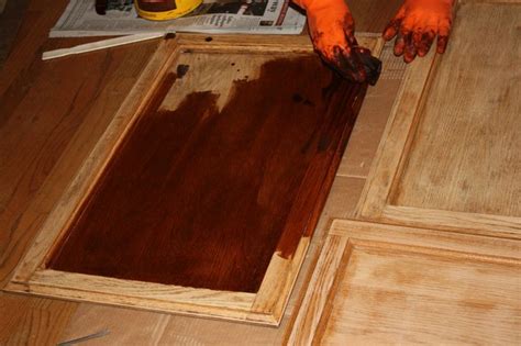 Make over your kitchen cabinets for cheap with this easy and quick painted kitchen cabinet upgrade for cheap. restaining kitchen cabinets darker | Sanding, Staining, and Varathane | Stained kitchen cabinets ...