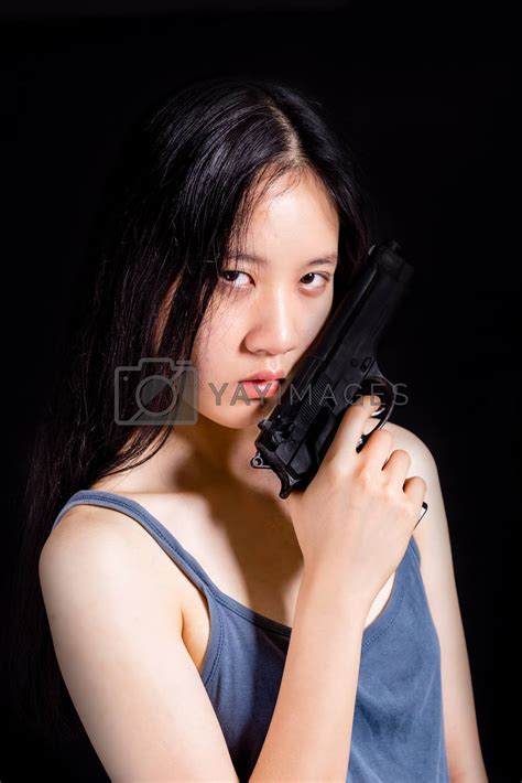 teenage asian girl with pistol by imagesbykenny vectors and illustrations free download yayimages