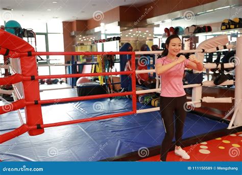 Asain Chinese Smiling Girl Boxing In The Gym Sports Power Stock